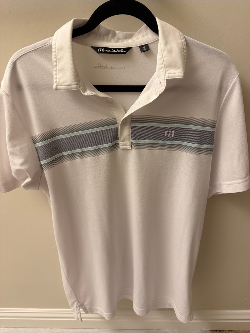 Travis Mathew White Polo with Gray and Mint Chest Stripes